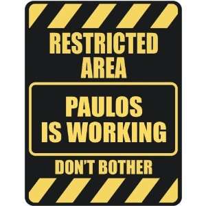   RESTRICTED AREA PAULOS IS WORKING  PARKING SIGN