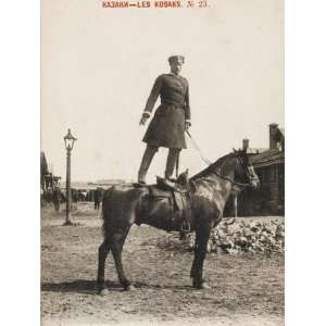  A Russian Cossack Standing on the Back of His Horse 