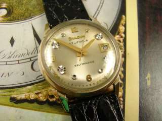 TAKE A LOOK AT THE GOLD TONE DIAL WITH GORGEOUS SHEEN & DIAMOND 