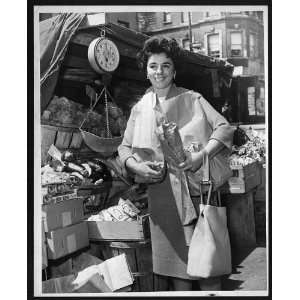  Miss Ellen Lewin shoping in Bleecker Street Market,smiling 