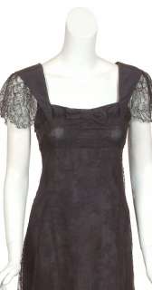 size 2 feminine black lace dress has black fabric trim and front bow 