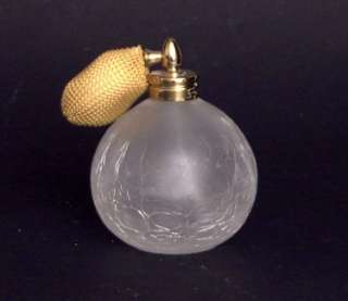 his is a medium sized Perfume Bottle with atomizer in white crackle 