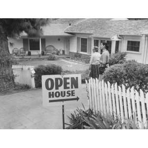  Realtor Pat Devault Showing a House to Her Clients 