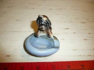 You are bidding on a little ceramic dog, too cute to throw out, so he 