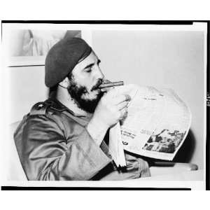  Fidel Castro catches up on the news 1961