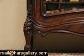 An elegant antique French Louis XV design rosewood armoire has shaped 