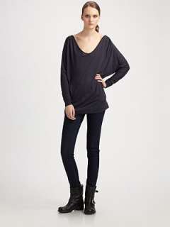 Draped scoopneck Long dolman sleeves Banded hem Longer length hits 