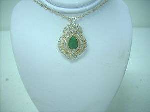 Tear dropped jade pendant /dia and 18kt gold  
