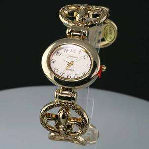 FLEUR DE LIS GOLD BANGLE WATCH  