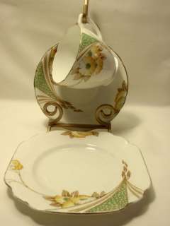   , Saucer and Plate Trio White with Yellow Flowers & Gold Trim  